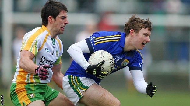 Kerry's James O'Donoghue with Paddy McGrath of Donegal