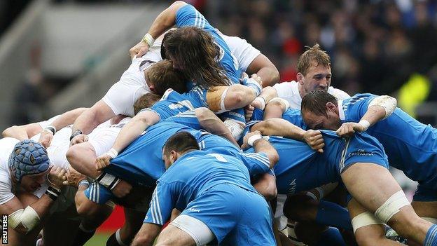 Typically brutal action as England (left) and Italy go hard in a scrum on Sunday