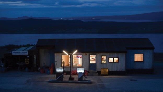 Petrol station lit up at night