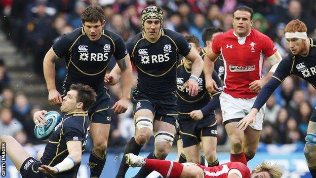 Scotland's centre Sean Lamont (left) is grounded during the defeat by Wales