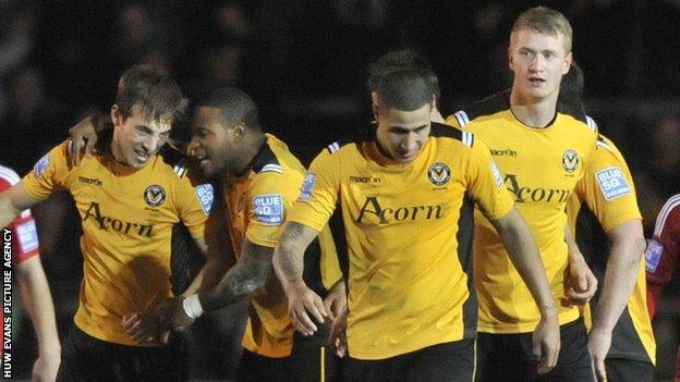 Newport County's players celebrate a goal