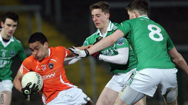 Armagh goal-scorer Jemar Hall is tackled by Fermanagh's Lee Breen