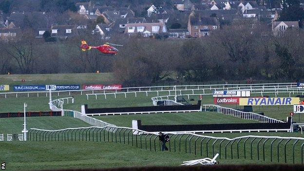 An air ambulance arrives at Cheltenham racecourse for jockey JT McNamara