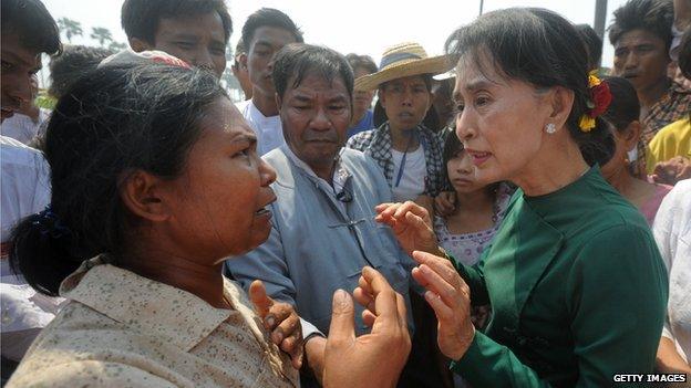 Aung San Suu Kyi speaks to a Copper Mine protester