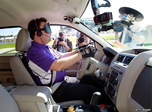 Blind driver in adapted car