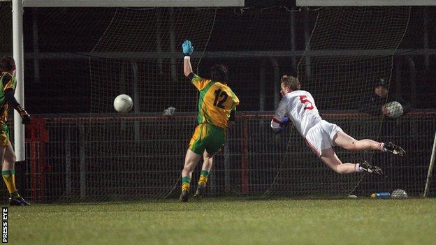 Tyrone's Stefan Tierney (right) scores a goal against Donegal