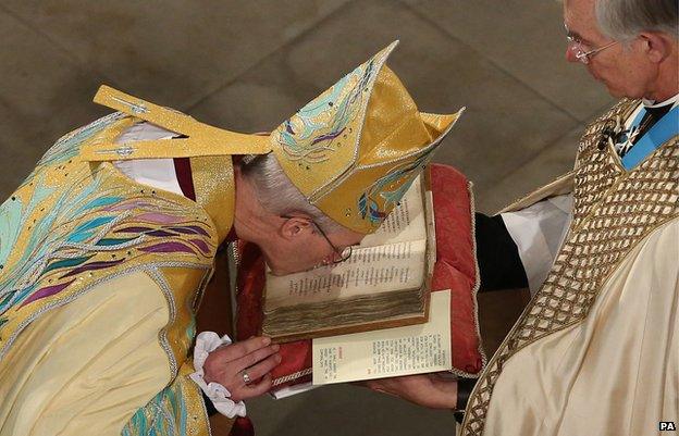 Justin Welby kissing the Canterbury Gospels