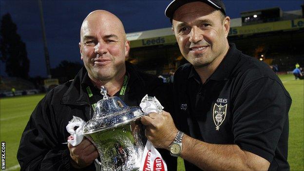 Brian McClennan and Terry Matterson celebrate the 2011 Exiles victory.