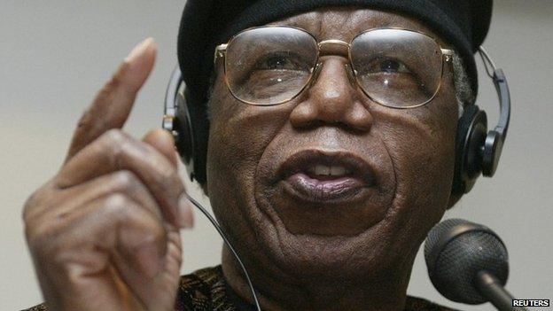 Nigerian author Chinua Achebe gestures during a news conference held during the Frankfurt bookfair on 12 October 2002