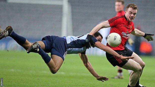 Dublin's Craig Dyas with a flying tackle on Brendan McArdle