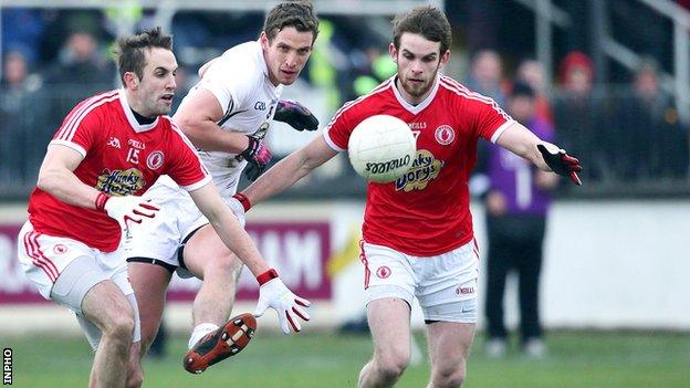 Kildare's Hugh Lynch with Mark Donnelly and Ronan McNamee of Tyrone