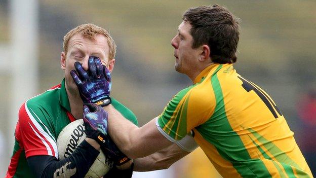 Mayo's Richie Feeney and Ryan Bradley of Donegal