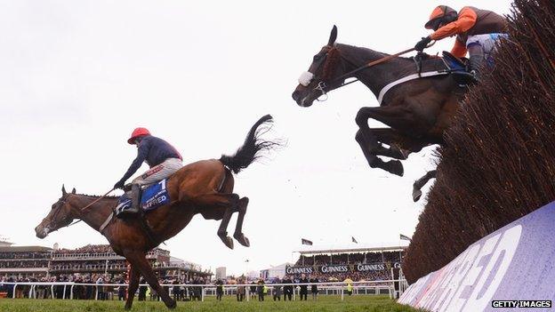 Barry Geraghty on Bob's Worth land safely over the last ahead of Long Run and Sir des Champs on their way to victory in the Chentenham Gold Cup Steeple Chase