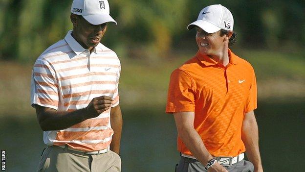 Tiger Woods (left) replaced Rory McIlroy as world number one after winning his third event of 2013