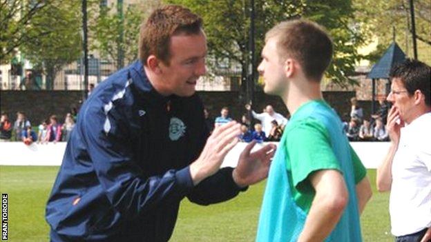 Kevin Graham talks to a Guernsey substitute