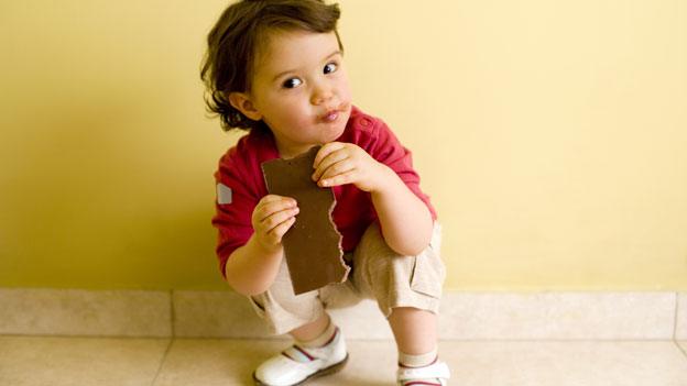 Child with chocolate bar