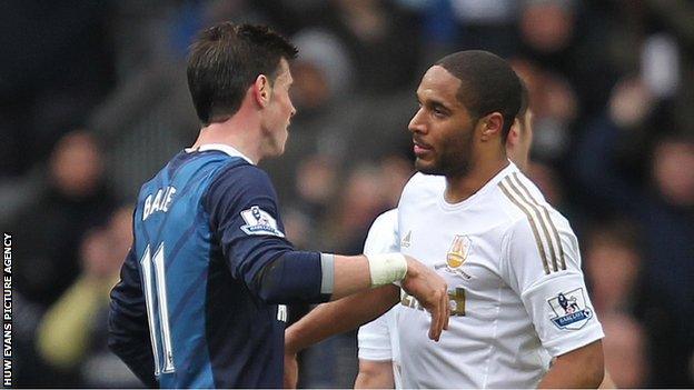 Fellow Wales star Gareth Bale commiserates with Ashley Williams after his Spurs side beat Swansea