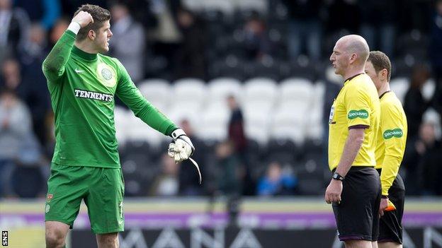 Celtic goalkeeper Fraser Forster exchanges words with referee Bobby Madden