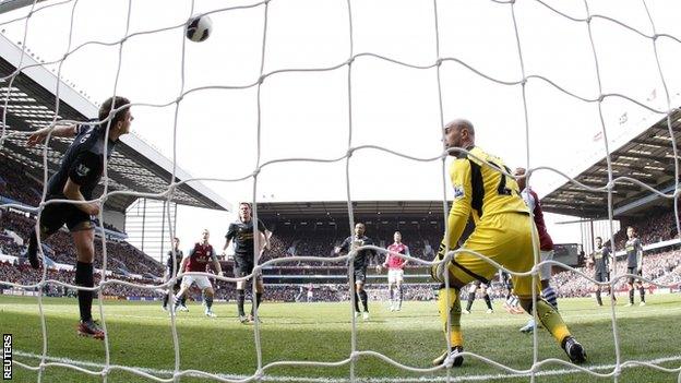 Steven Gerrard clears off the line