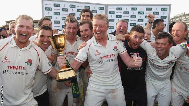 Glen Chapple celebrates Lancashire's Championship success of 2011