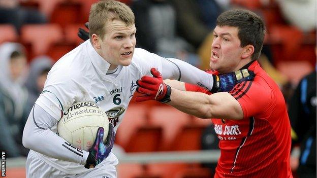 Kildare's Peter Kelly in action against Peter Turley of Down