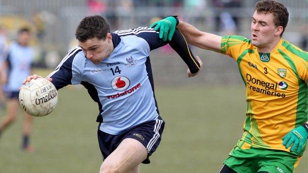 Dublin's Paddy Andrews in posession against Donegal's Eamonn McGee