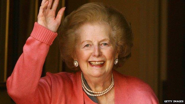 Baroness Thatcher waves from a doorway