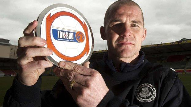 Alan Archibald with his award