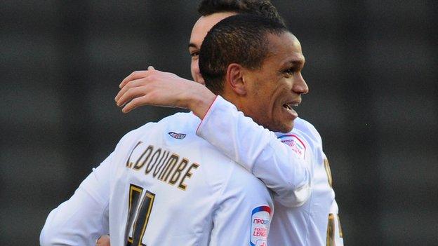 Mathias Doumbe celebrates scoring for MK Dons