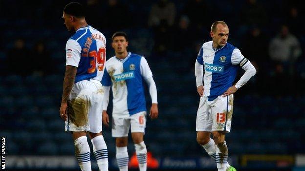 Blackburn Rovers players look dejected after conceding a goal