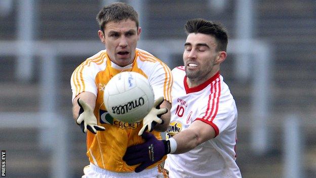 Tony Scullion in action for Antrim in the McKenna Cup against Tyrone earlier this season