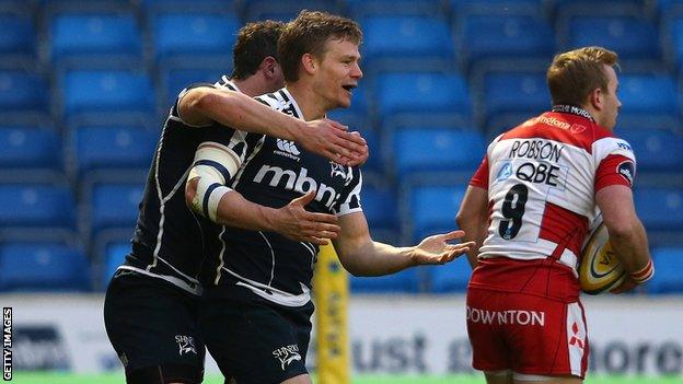 Dwayne Peel celebrates his early try for Sale against Gloucester