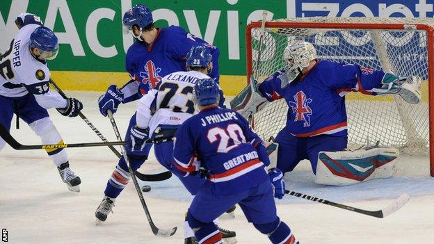 Great Britain players attempt to stop Dmitry Upper of Kazakhstan