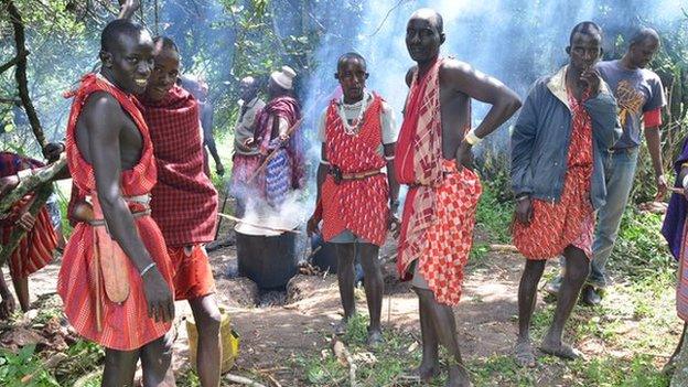 Maasai men prepare cow meat to feed the protesters - 90% of Maasai in Loliondo depend on raising cattle