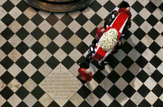 Margaret Thatcher's coffin being carried through St Paul's Cathedral