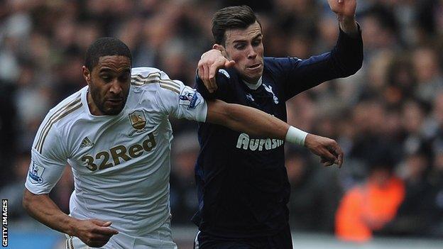 Ashley Williams battles with Tottenham's Gareth Bale