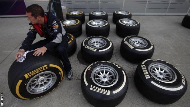 Red Bull mechanic with tyres