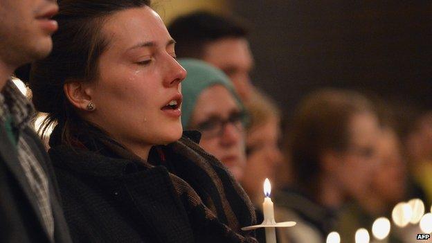 Mourners at a candlelight vigil