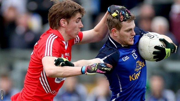 Cork's Ian Maguire challenges Enda Reilly in the semi-final