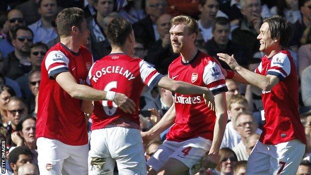 Per Mertesacker (second right) celebrates his goal