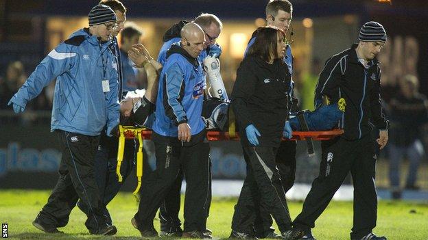 Glasgow's Duncan Weir leaves the field on a stretcher