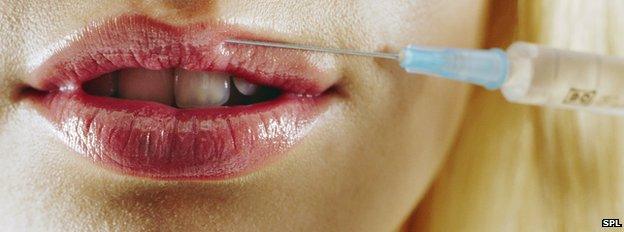 Woman's lips being injected