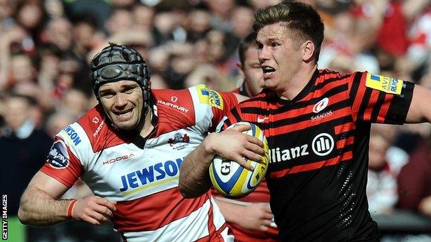 Saracens fly-half Owen Farrell takes on the Gloucester defence