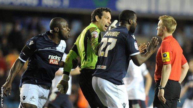 Millwall's Danny Shittu, David Forde and Karleigh Osborne remonstrate with Gavin Ward