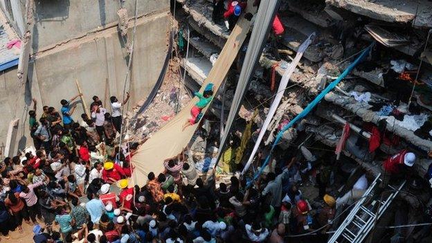 Volunteers attempt to rescue workers after a building in Bangladesh collapses