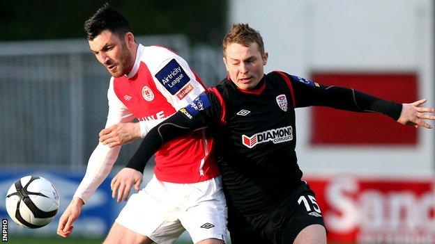 Killian Brennan of St Pat's in action against Derry striker Michael Rafter