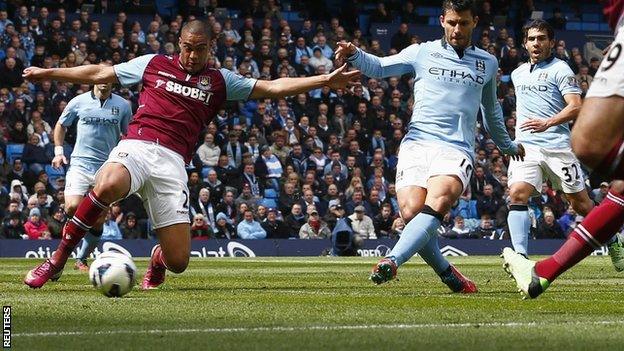 Man City striker Sergio Aguero (second from right) slots in a goal against West Ham