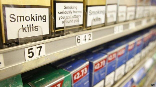 Cigarettes displayed in cabinet