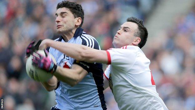 Tyrone's Cathal McCarron tackles Bernard Brogan at Croke Park