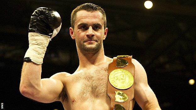 John Simpson poses with the Celtic super-featherweight championship belt after stopping Dai Davies